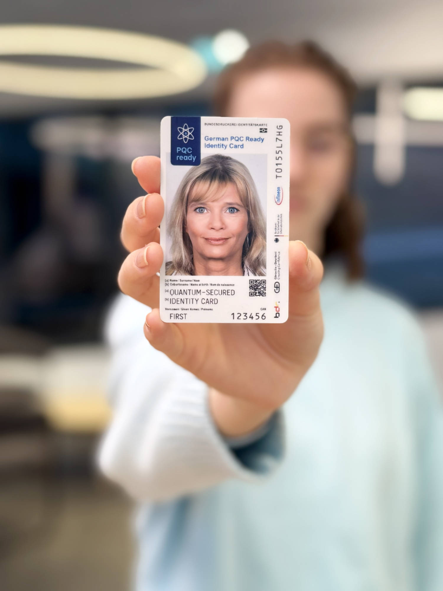 Woman demonstrates quantum-secure ID-card.