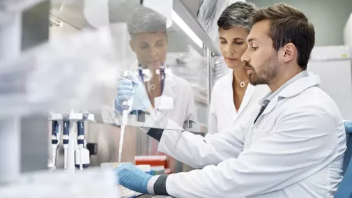 man and women researching in a ab